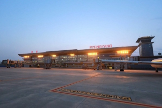 Illustration for article titled 'Look At My Fancy New Airport Terminal,' Says Noted Despot Kim Jong Un
